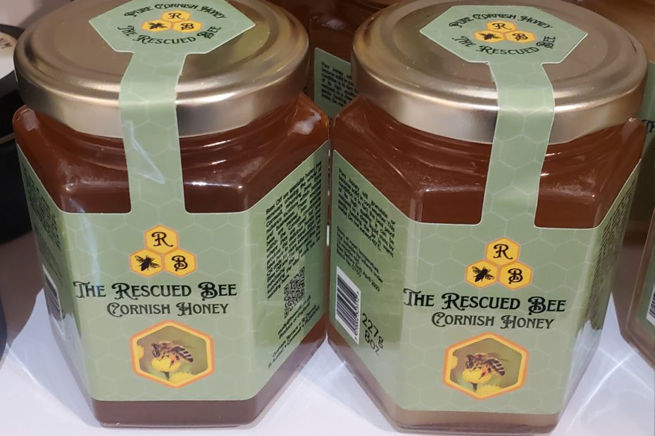 Photograph of jars of honey, with The Rescued Bee logo showing